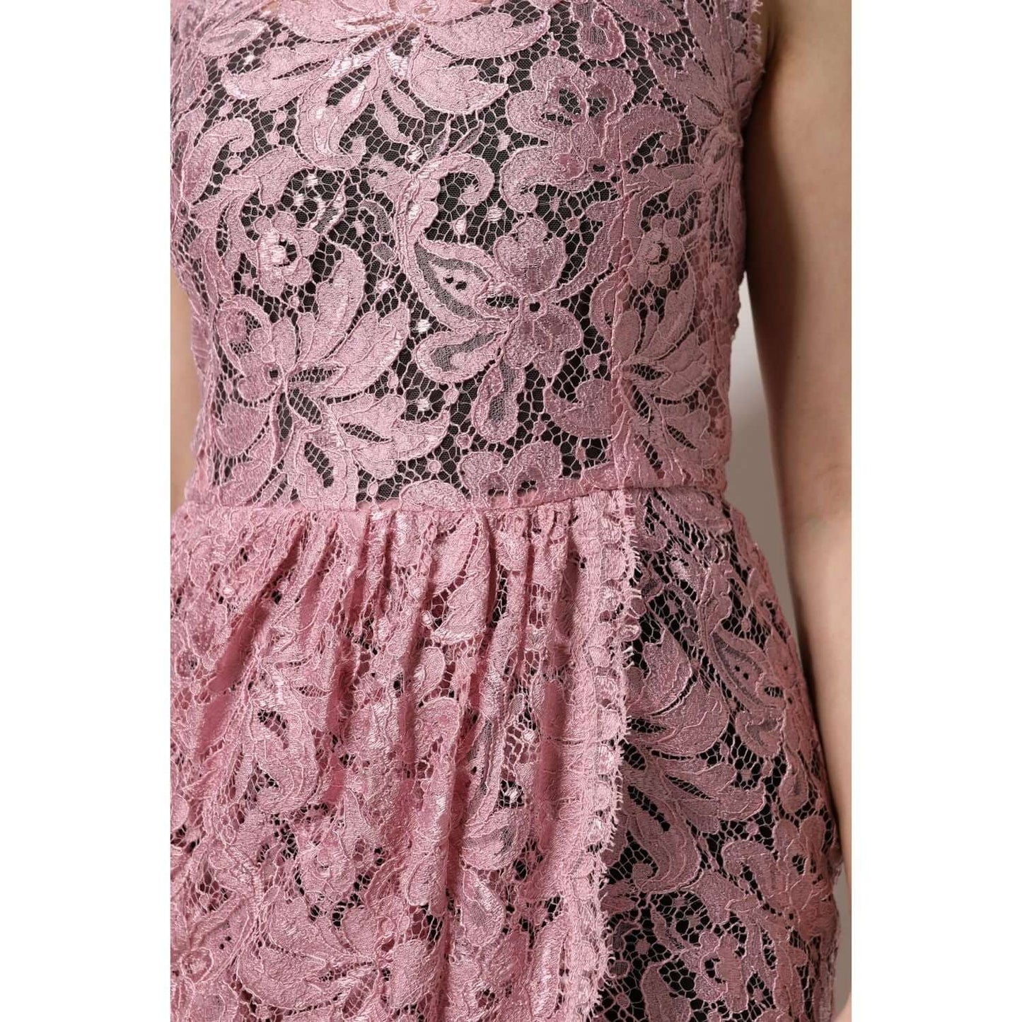 Dolce & Gabbana pink floral lace sleeveless sheath dress close-up showing intricate lace details.