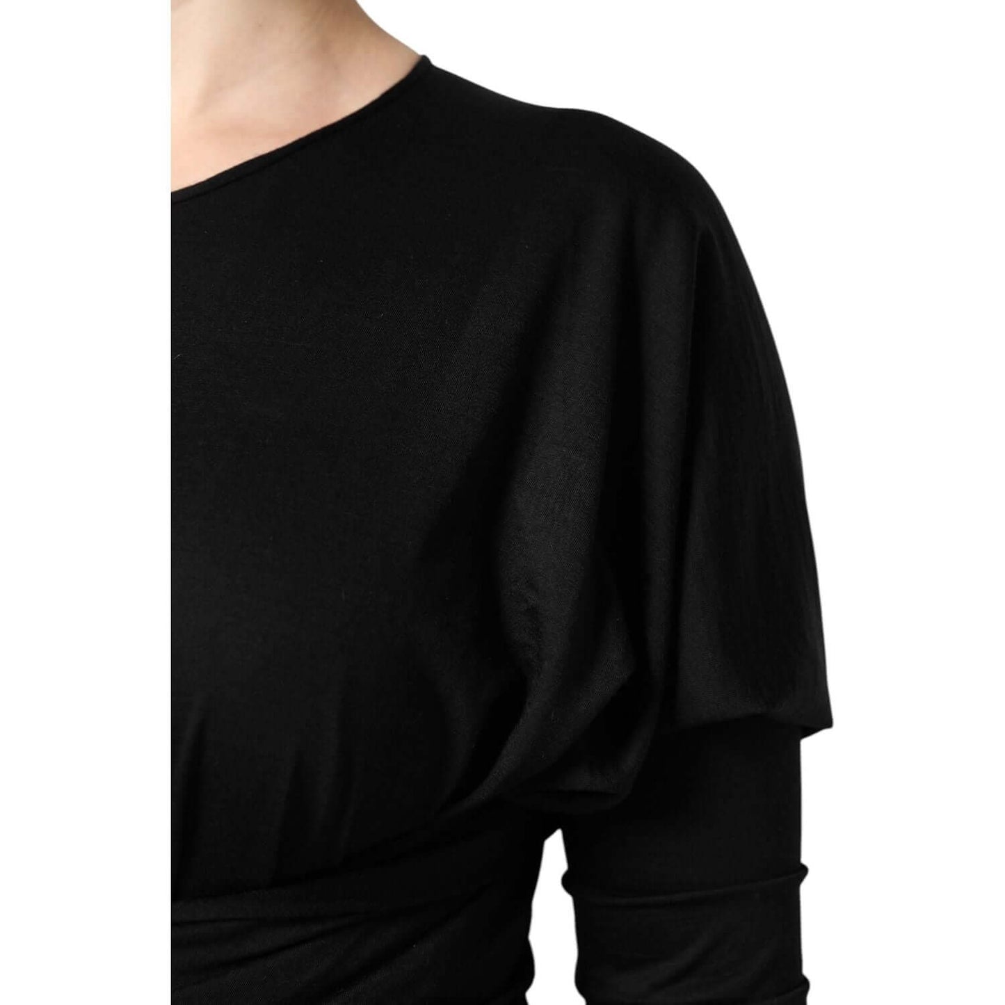 Close-up of Dolce & Gabbana black wool long sleeve sheath midi dress, showcasing elegant design and high-quality craftsmanship.
