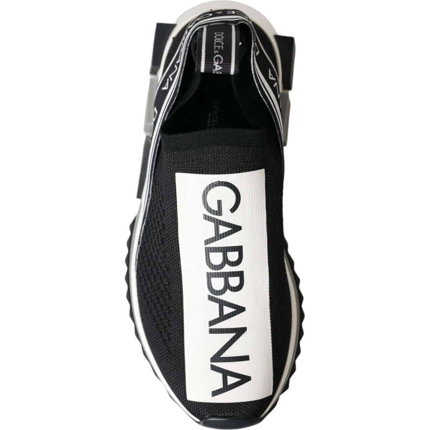 Dolce & Gabbana Sorrento black and white slip-on sneakers with logo print, top view.