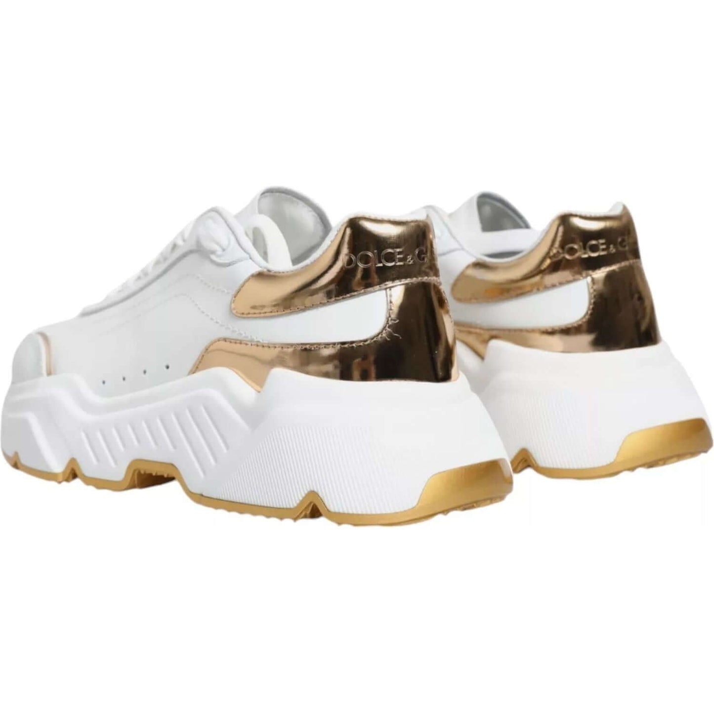 Dolce & Gabbana white and gold Daymaster low-top sneakers with logo, made in Italy, featuring rubber sole and lace-up closure.
