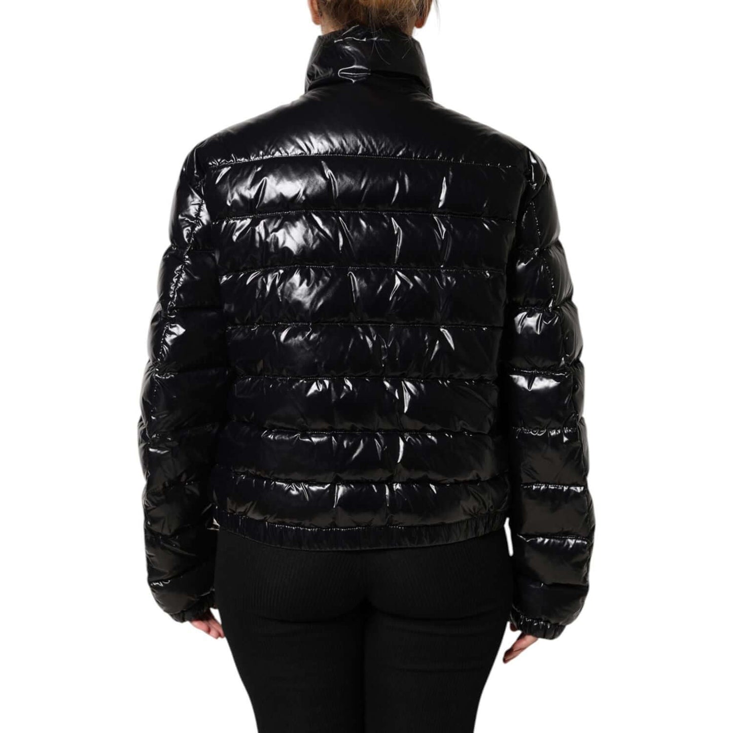Rear view of Dolce & Gabbana black full zip puffer jacket with logo plaque, featuring long sleeves and high craftsmanship.