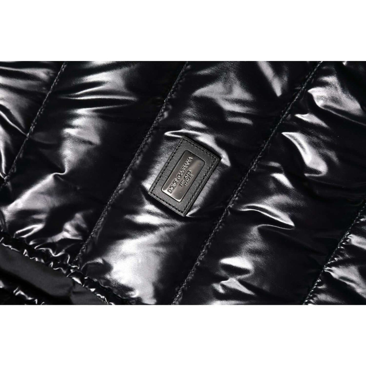 Dolce & Gabbana black puffer jacket with logo plaque, full zip closure, luxury outerwear made in Italy