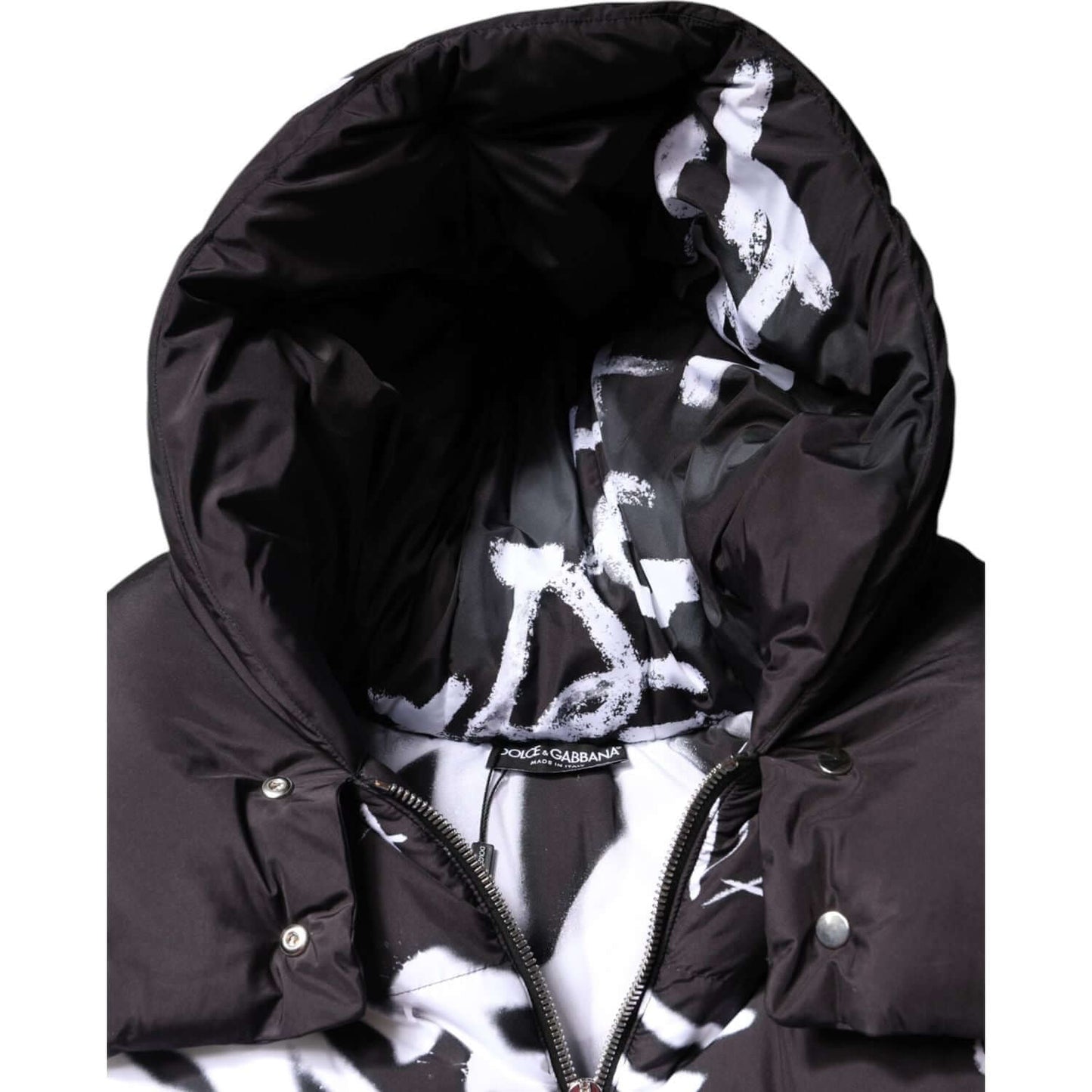 Dolce & Gabbana black padded hooded jacket with full zip closure, featuring branded interior detail, luxury winter wear.