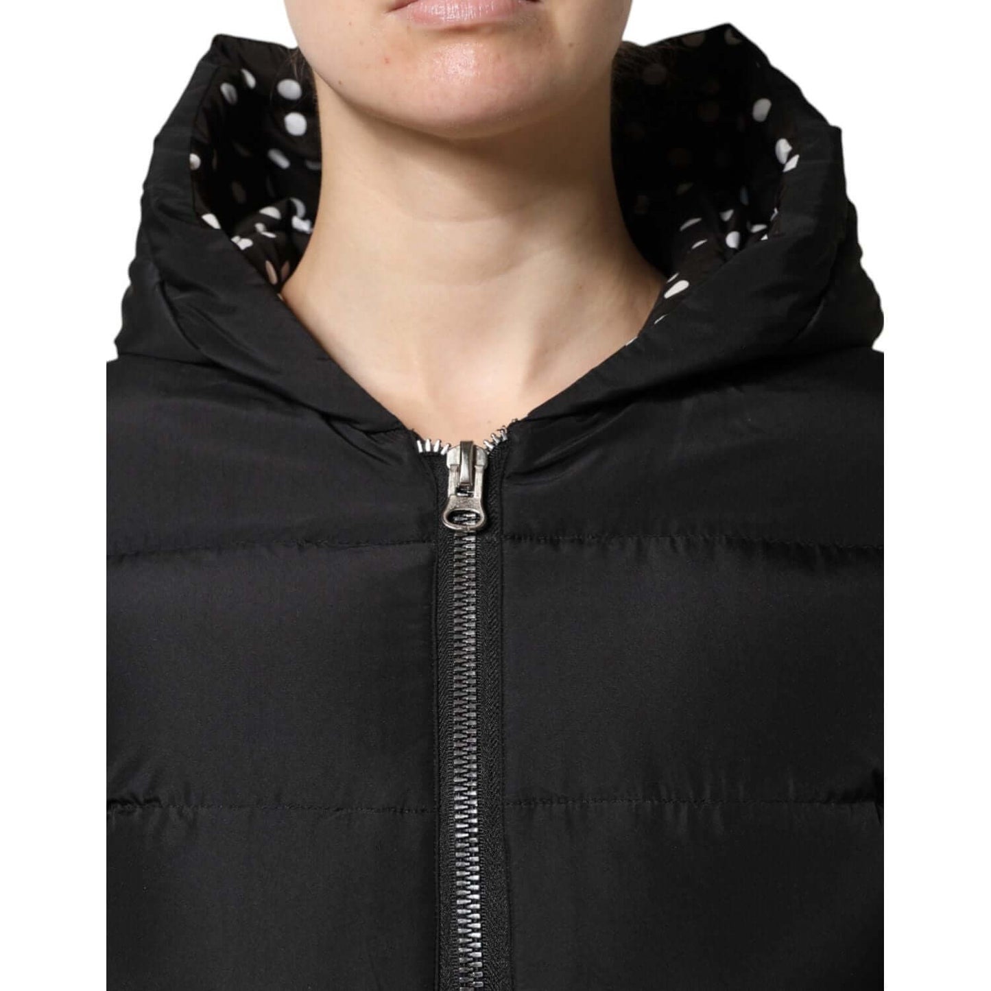 Dolce & Gabbana black hooded zip reversible jacket, showing zipper and polka dot lining.