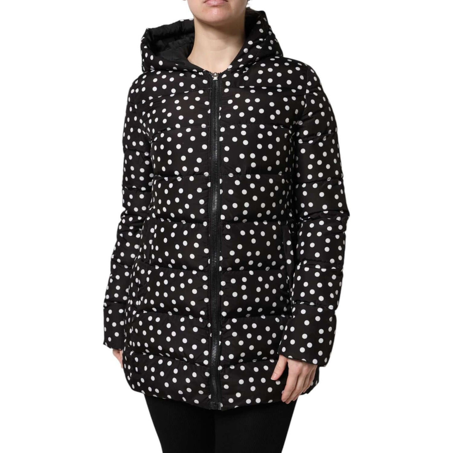 Dolce & Gabbana black and white polka dot hooded puffer jacket with zip closure, reversible design, showcasing luxurious Italian craftsmanship.