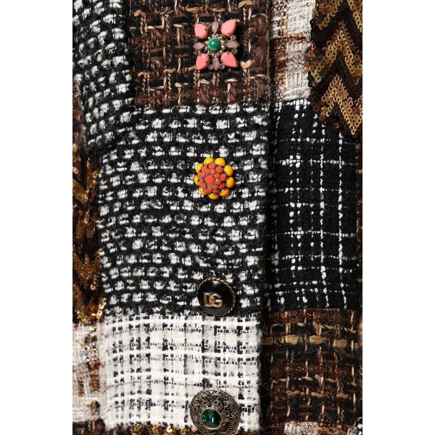 Close-up of Dolce & Gabbana multicolor patchwork jacket with intricate button details, highlighting woven texture and craftsmanship.