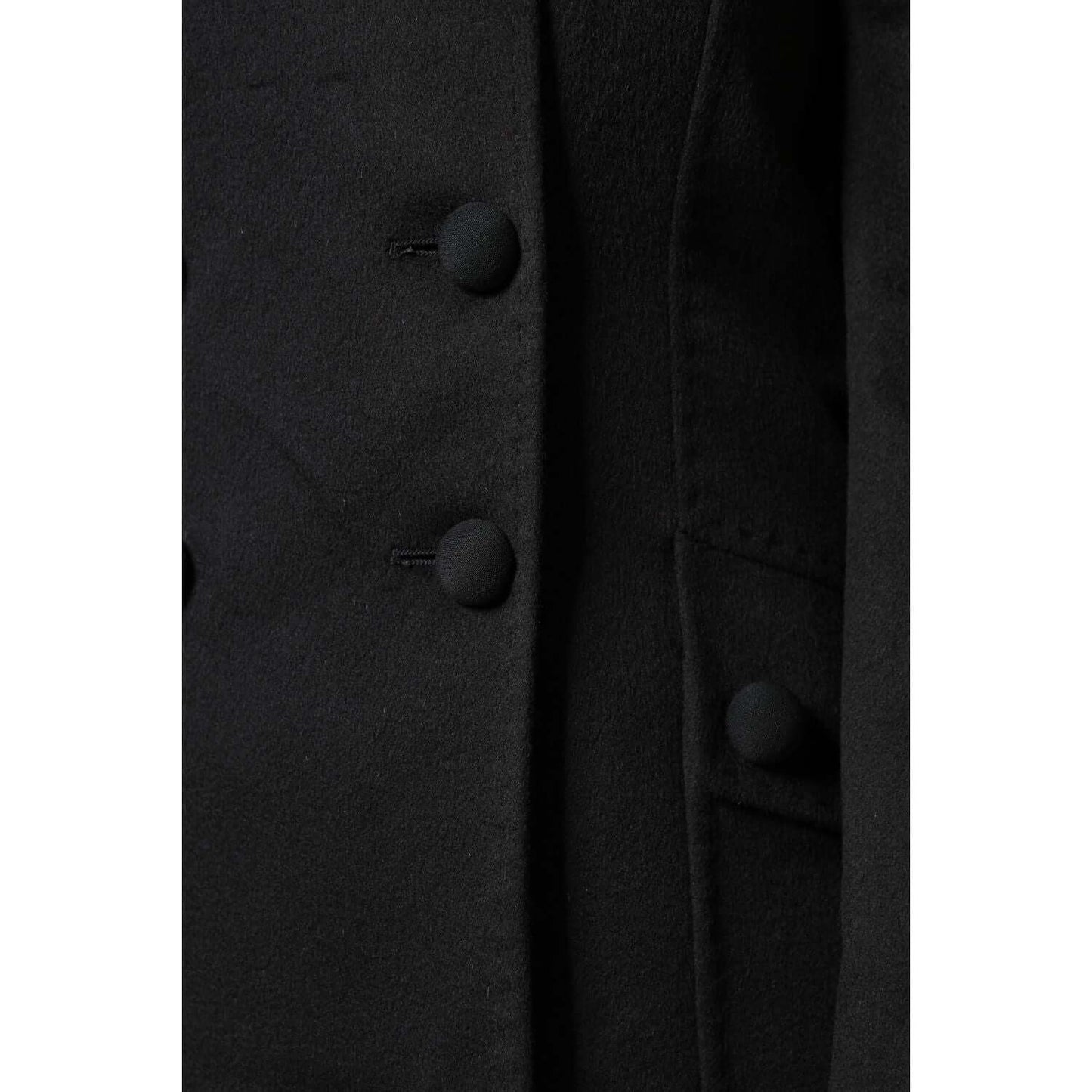 Close-up of Dolce & Gabbana black wool double-breasted blazer with button details, highlighting elegant craftsmanship and Italian design.
