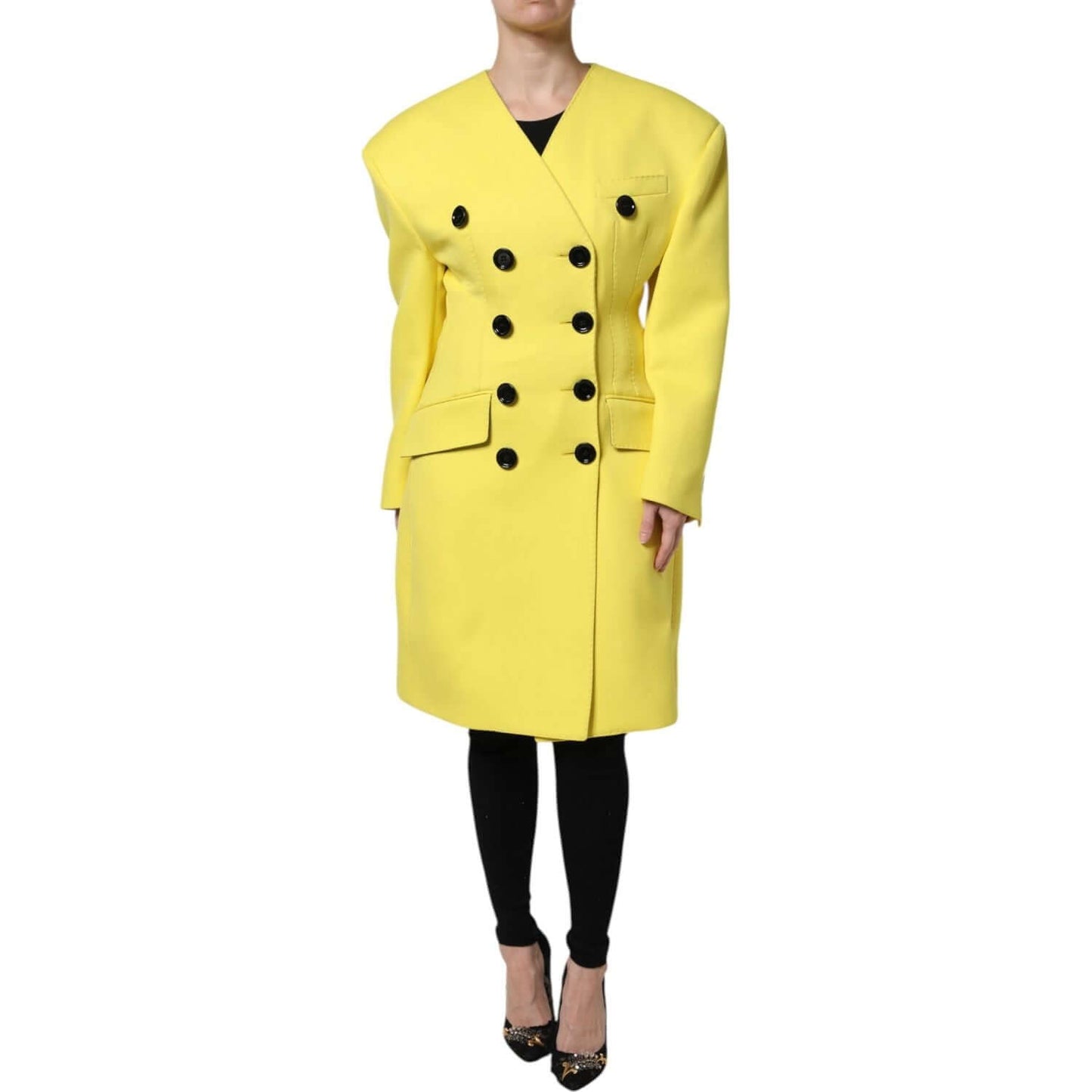 Dolce & Gabbana yellow double breasted trench coat jacket made of 100% virgin wool with button closure and logo details, modelled front view.