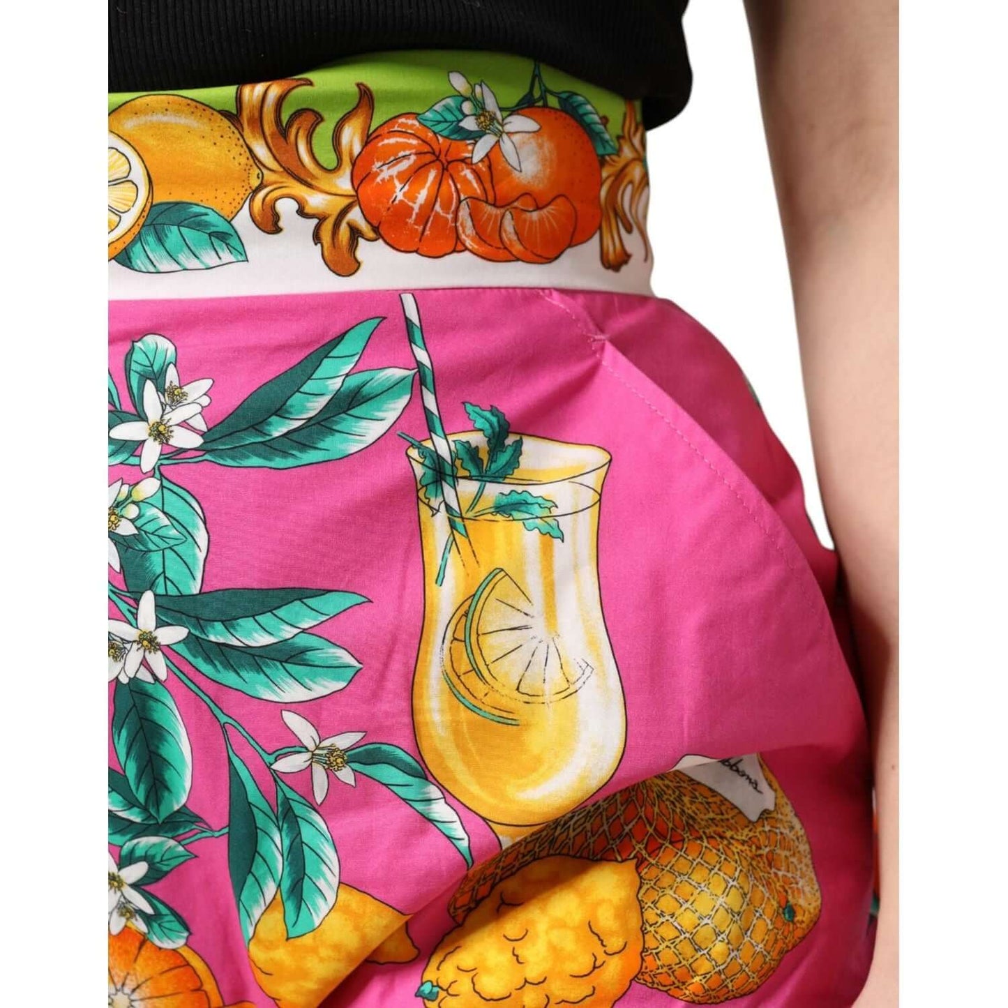 Dolce & Gabbana pink high waist shorts with fruit print, featuring vibrant oranges and lemons. 100% cotton. Elegant Italian design.
