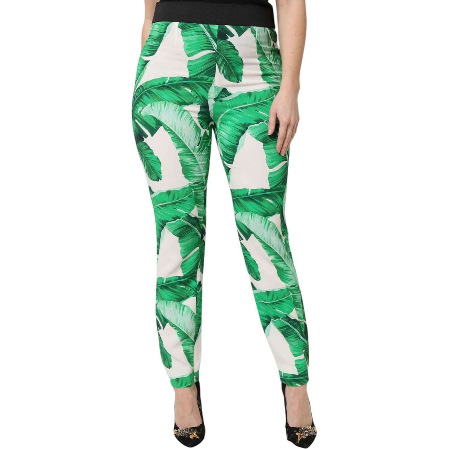 Dolce & Gabbana white high waist pants with green leaf print, made from 100% viscose, featuring zipper closure and logo details.