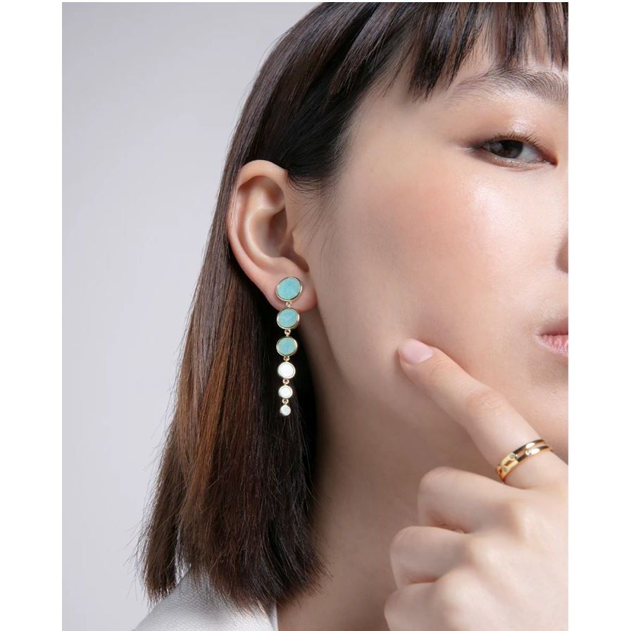 Woman wearing VICEROY JEWELS Mod. 2300E100-43 earrings in a close-up shot showcasing silver and turquoise design.