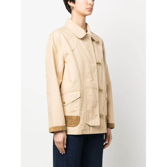Woman wearing Fay Coats Beige cotton shirt jacket with front button fastening and cargo pockets, viewed from the side.