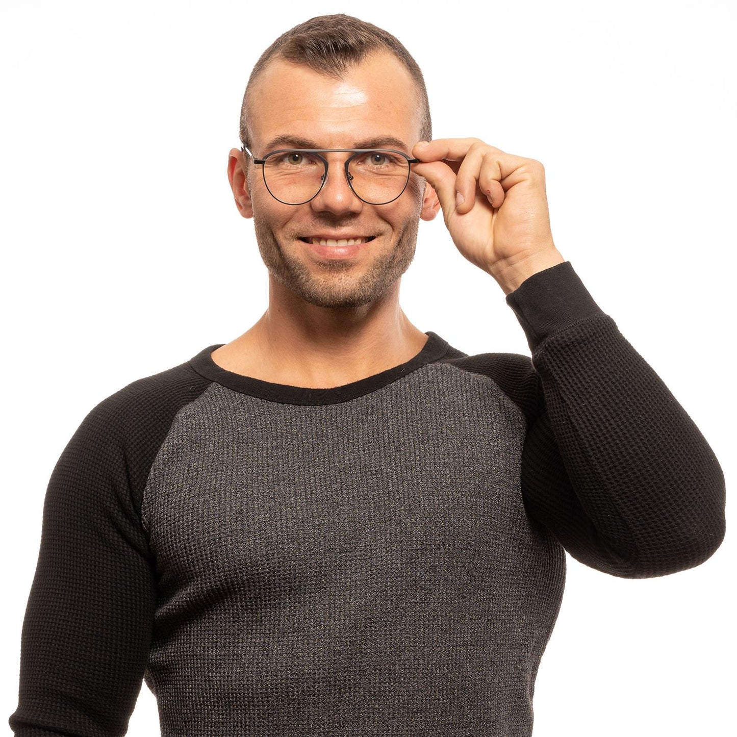Man wearing Yohji Yamamoto Black Plastic Glasses (Frames) with full-rim round style, posing in a black and gray sweater.