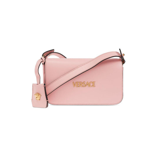 Light pink Versace Tag mini shoulder bag with foldover top and adjustable strap, featuring gold logo and compact size for versatile use.