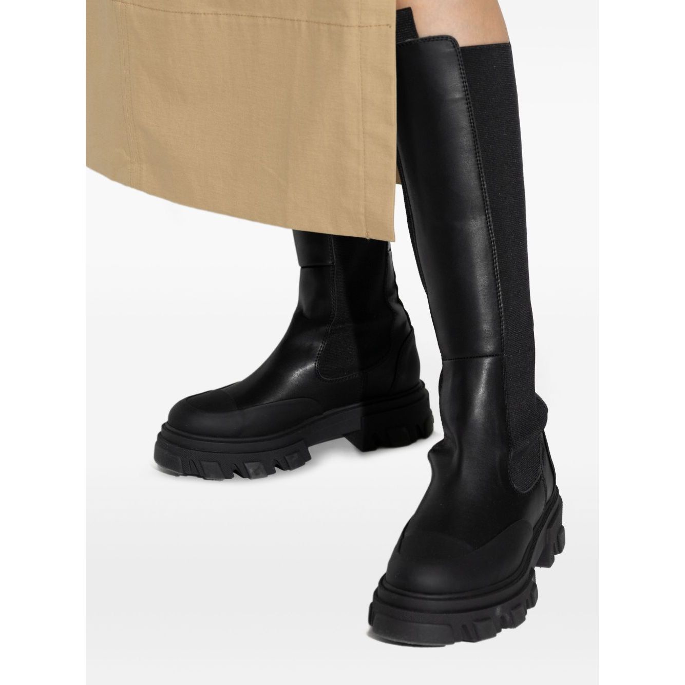 GANNI Boots Black with chunky lug sole and elasticated sides, featuring dual pull-tabs and round toe design in faux-leather.