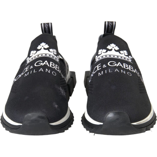 Dolce & Gabbana black and white 'Sorrento' slip-on sneakers with logo print and rubber sole from front view.
