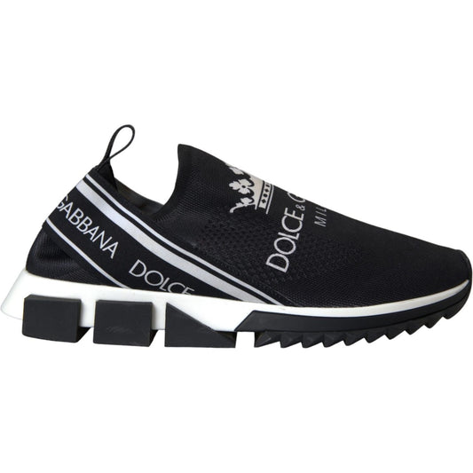Dolce & Gabbana Black White Sorrento Slip On Sneakers with logo, fabric pull, and decorative rubber sole. High-end fashion footwear, side view.