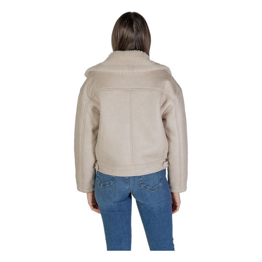 Woman wearing a Vila Clothes beige artificial leather jacket and coat, showcasing fall/winter fashion with faux leather composition.