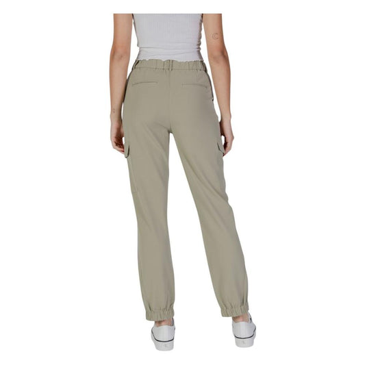 Back view of a woman wearing B.Young green polyester spring/summer pants with elastic cuffs, perfect for a casual look.