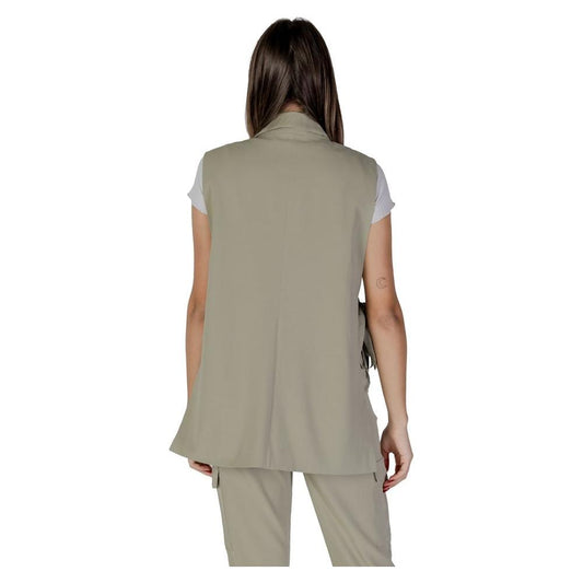 Back view of woman wearing B.Young green polyester vest, part of spring/summer collection, made with polyester, viscose, elastane.