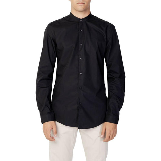 Man wearing Antony Morato black cotton slim fit shirt with long sleeves and refined collar, ideal for formal or casual occasions.