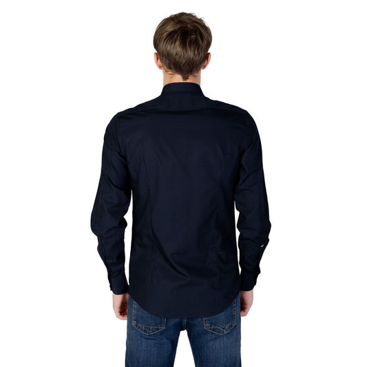 Back view of Antony Morato blue cotton shirt, long-sleeve design, paired with jeans, showcasing elegant style.