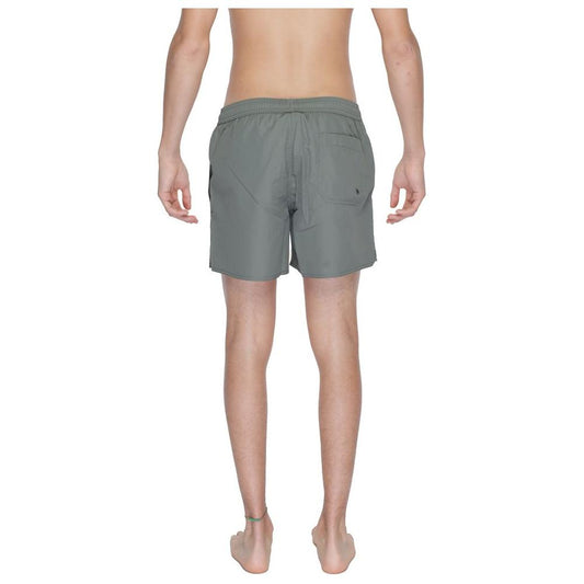 Back view of Emporio Armani men's green polyester boxer swimwear, showcasing regular fit and stylish design suitable for beach or pool.