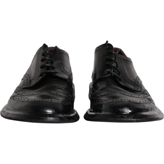 Dolce & Gabbana black leather derby wingtip formal shoes, Italian craftsmanship, 100% calfskin, lace-up with logo details.
