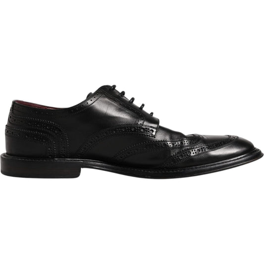 Dolce & Gabbana black leather derby wingtip formal shoes, 100% calfskin, lace-up with logo details. High craftsmanship, preowned.