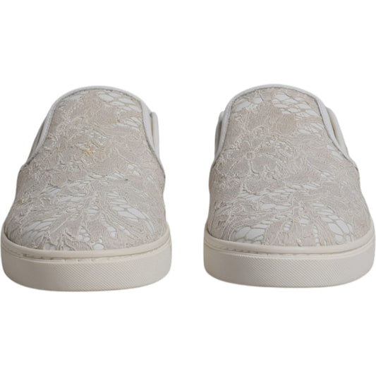 Dolce & Gabbana white floral lace slip-on loafers with minor glue marks, rubber sole, made in Italy, front view.