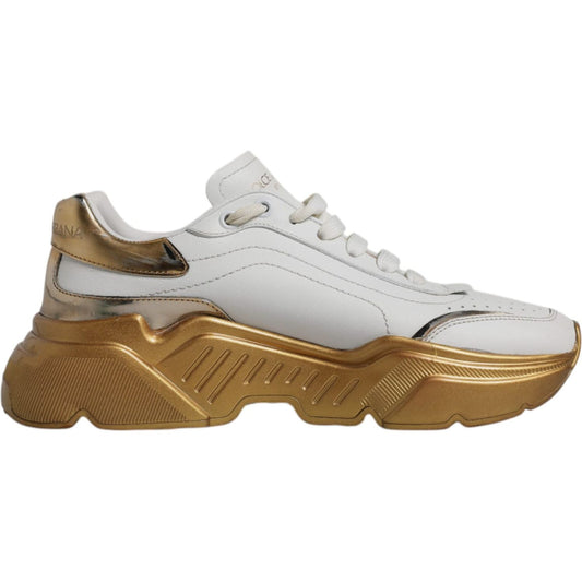 Dolce & Gabbana white and gold Daymaster low-top sneakers with a rubber sole and lace-up closure.