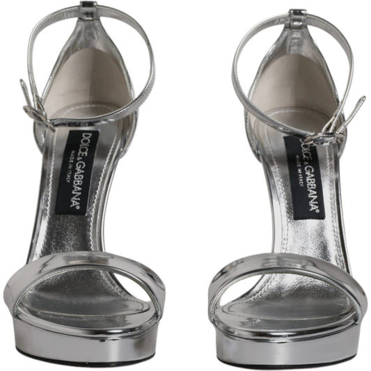 Dolce & Gabbana KEIRA silver ankle strap heels, made in Italy, featuring leather sole and logo detail, front view of sandals.