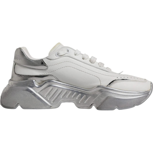 Dolce & Gabbana white silver Daymaster low-top sneakers with lace-up closure and logo details, made of calf leather and rubber soles.
