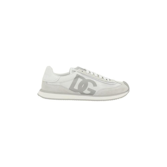 Dolce & Gabbana sneakers with suede details, extended toe, logo on front tab, lace-up closure, textured sole, and monogram on heel.