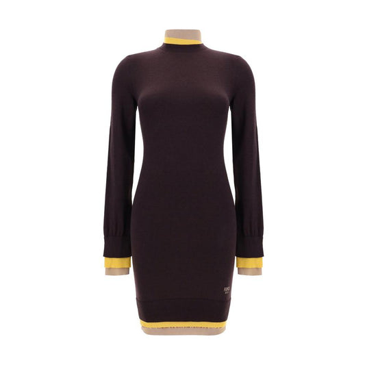 Fendi wool mini dress with long sleeves, ribbed collar and cuffs, trompe-l’oeil hem, and contrasting monogram. Slim fit fashion.