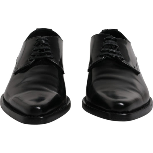 Dolce & Gabbana black patent leather derby men's dress shoes with lace-up closure, elegant design crafted in Italy, minor scratches visible.