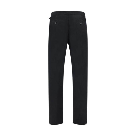 Back view of Alexander McQueen Arrow Belted Pants with welt pockets, combining elegance and modernity.