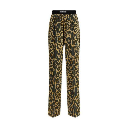 Tom Ford silk pants with animal print and elastic waistband, featuring side welt and back patch pockets for style and functionality.