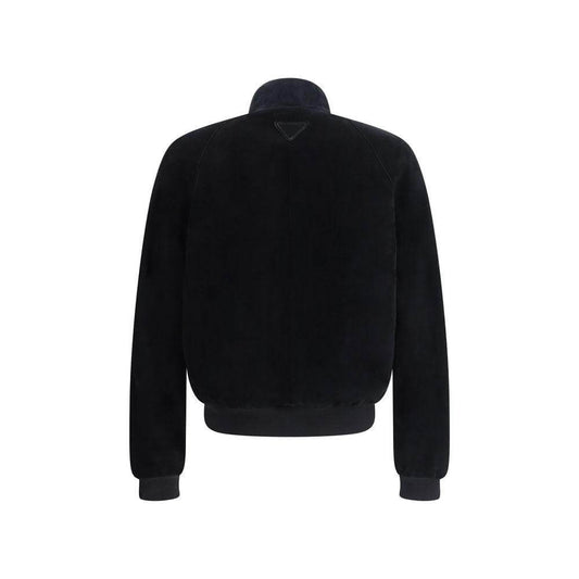 Back view of Prada suede bomber jacket with high collar, ribbed hem, cuffs, and triangular brand patch.
