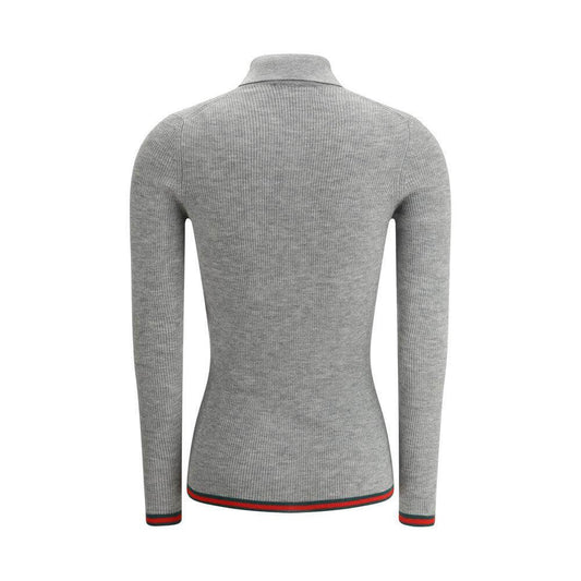 Back view of Gucci cashmere polo shirt with ribbed design, long sleeves, and iconic colored bands on hem and cuffs.