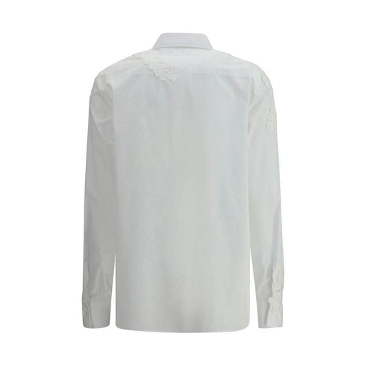 Back view of Ermanno Scervino embroidered white shirt showcasing elegant floral embroidery detail on shoulders and cuff.