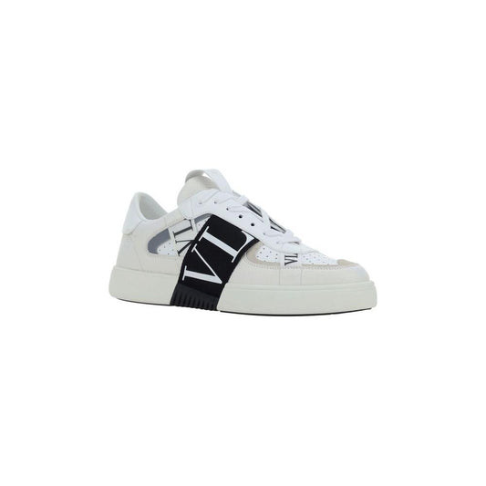 Valentino Garavani VL7N calfskin sneakers with perforated toe, flat sole, lace-up closure, embroidered logo, and iconic side monogram.