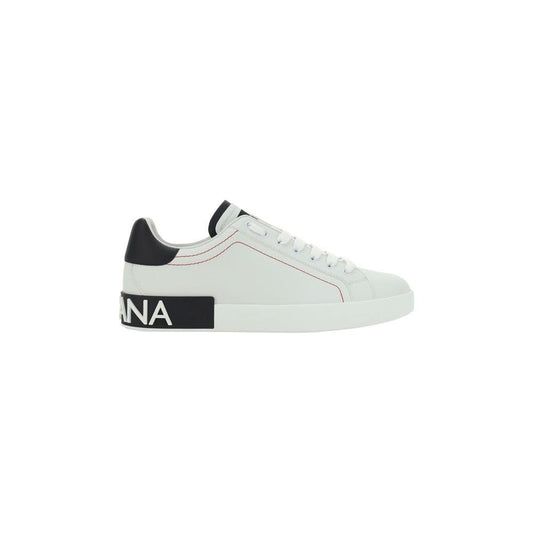 Dolce & Gabbana calfskin sneakers with lace-up front, raised sole, and brand embossed heel, featuring a contrasting logo patch on round toe.