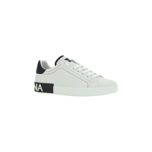 Dolce & Gabbana calfskin sneakers with lace-up front, raised sole, Dolce branding on heel, embroidered logo patch, and round toe.