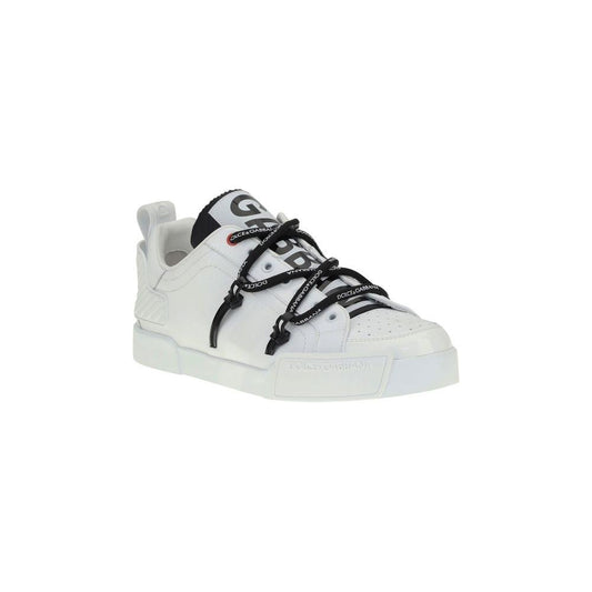 Dolce & Gabbana Portofino Sneakers in white patent leather with perforated round toe and black elastic laces, featuring logoed flat sole.