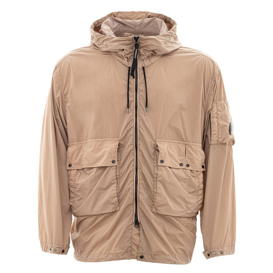 C.P. Company beige polyamide jacket with hood and front pockets, offering a sleek and durable urban style for contemporary wear.
