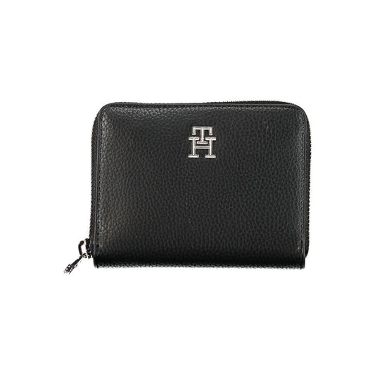 Elegant black Tommy Hilfiger wallet with logo, featuring multiple compartments and a secure zipper closure for optimal organization.