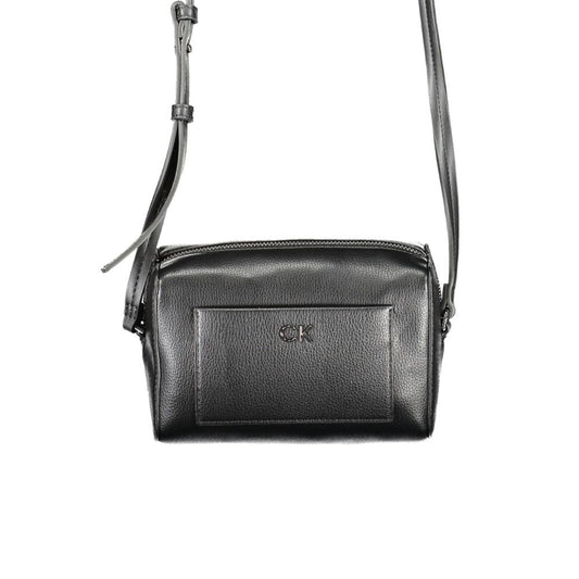 Calvin Klein black polyester handbag with adjustable shoulder strap, external and internal pockets, and zip closure.