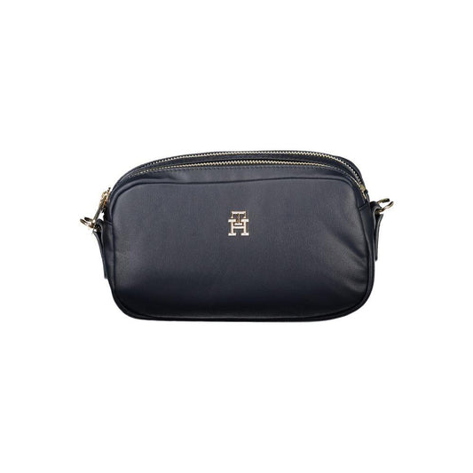 Tommy Hilfiger blue women handbag with logo, featuring adjustable strap, two compartments, and internal pocket for stylish organization.