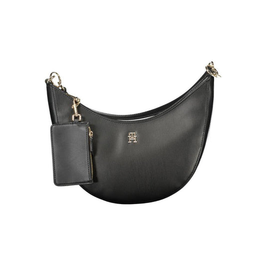 Tommy Hilfiger black polyethylene women's handbag with detachable strap and gold accents, featuring stylish and durable design.